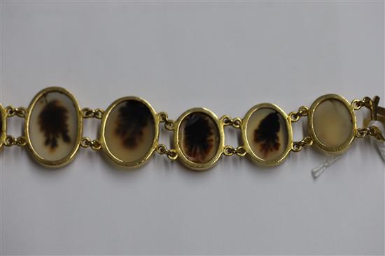 A late Victorian gold and moss agate bracelet, approximately 17cm.